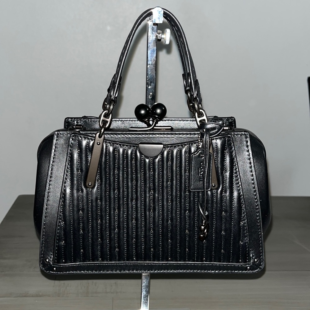 Coach Kiss Lock Dreamer